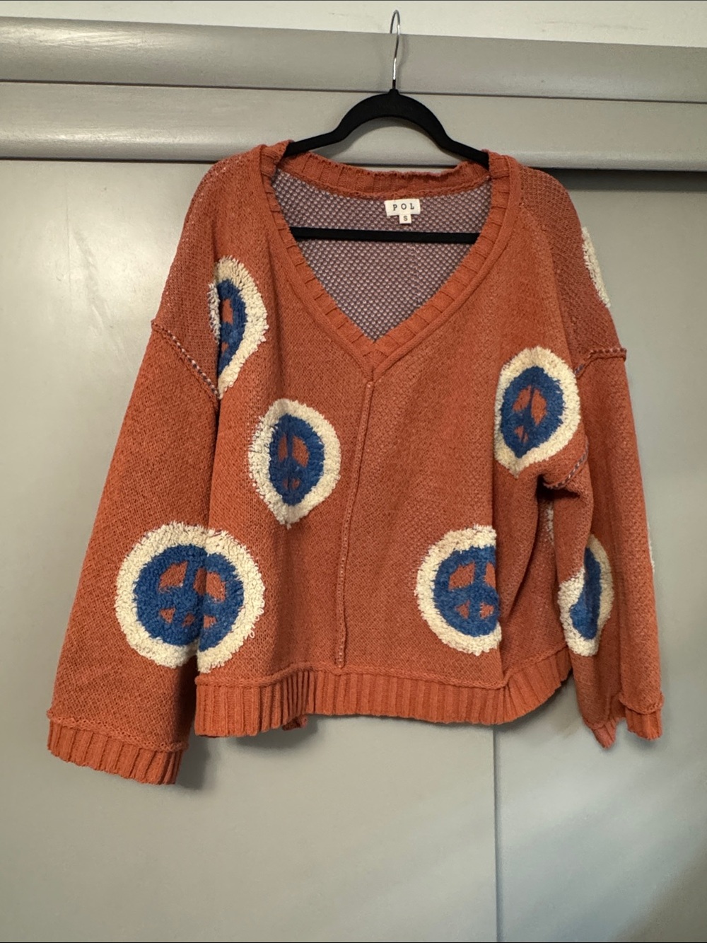 POL Rust Orange V-Neck Sweater with Blue and Cream Motifs